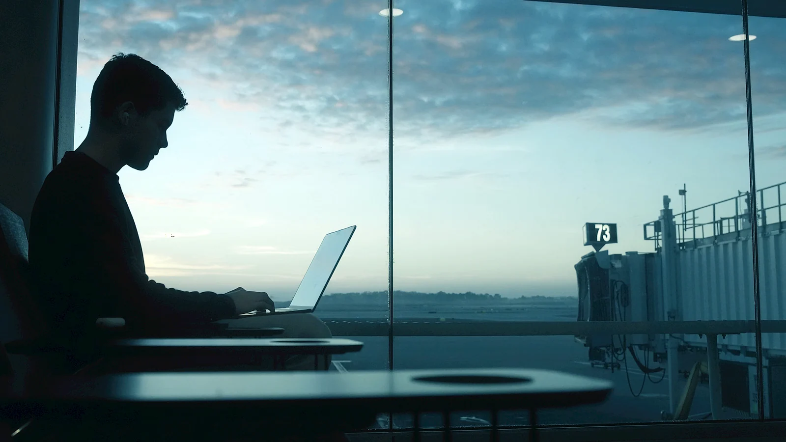 Traveler preparing a flight compensation claim on a laptop