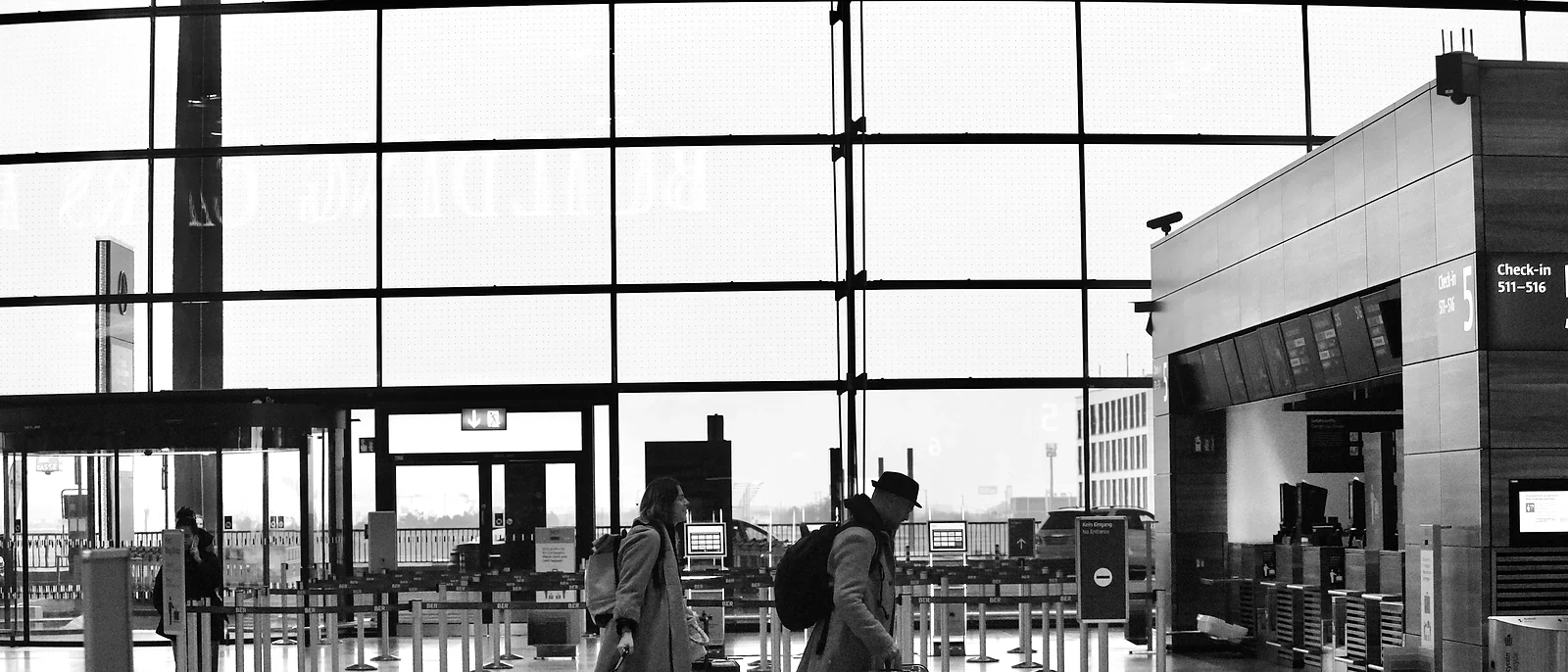 Travelers moving through an airport departures hall