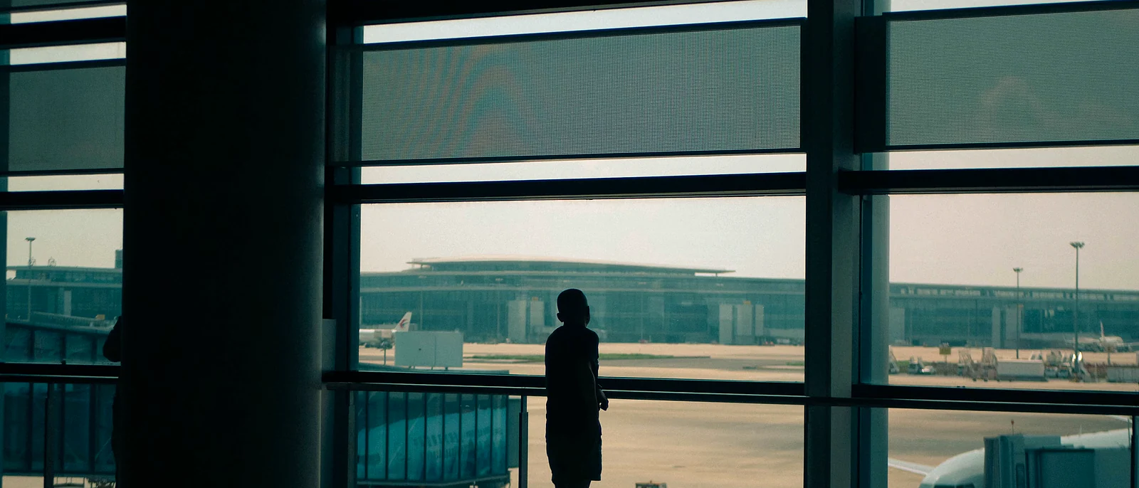 Passenger looking across airport gates before a flight route